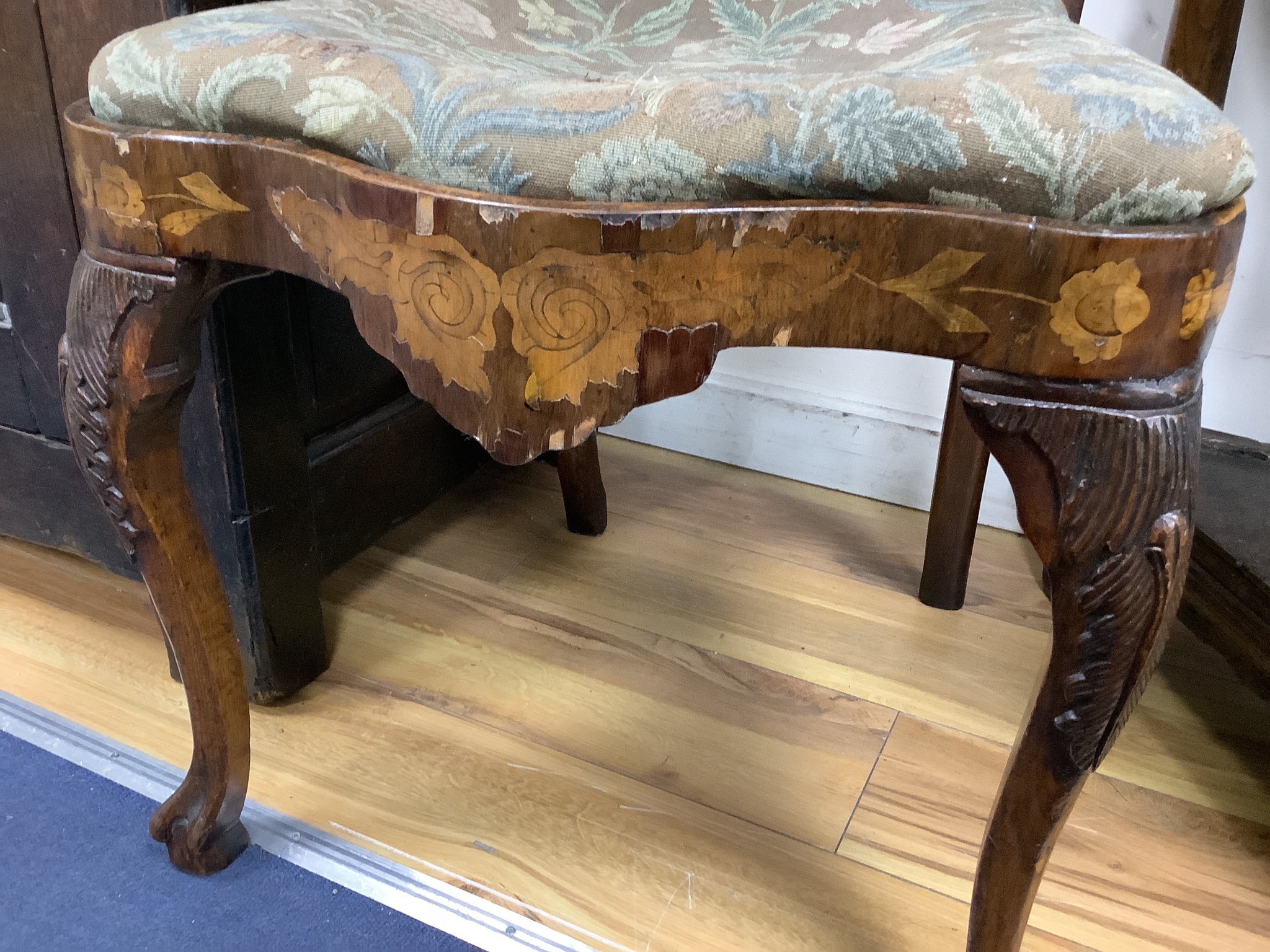 A pair of late 18th century Dutch floral marquetry walnut high back dining chairs